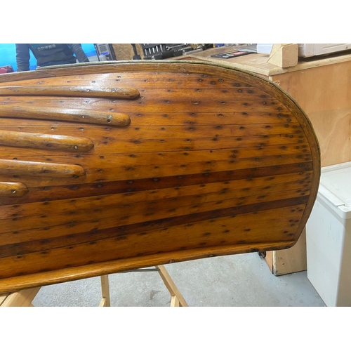 367 - An early 20th century Canadian cedar strip canoe of traditional construction with three seats, one w... 