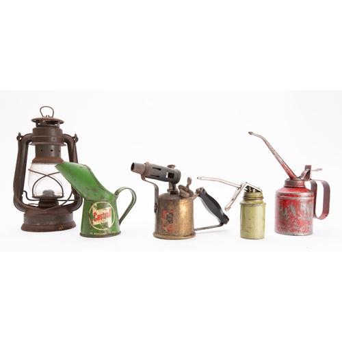 369 - A small green Castrol oil jug, two oil cans, a small Tilly lamp, and a brass blow torch, (5).