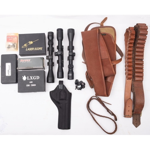 44 - A collection of shooting accessories, comprising cartridge belts, scopes, gun slip etc.