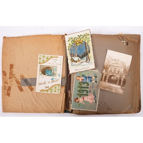 457 - An early 20th century postcard album and contents, GB topographical, including Temple bar, WWI regim... 