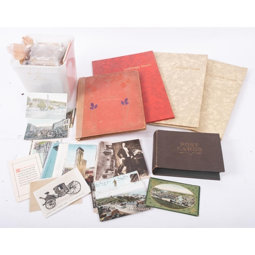 459 - A collection of early 20th century postcards, GB topographical and other subject matter, in two albu... 