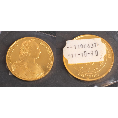 496 - A 'Maria Theresia' 100 ECU Belgian gold coin, dated 1989, diameter ca. 3.7cm, weight (inc plastic ca... 