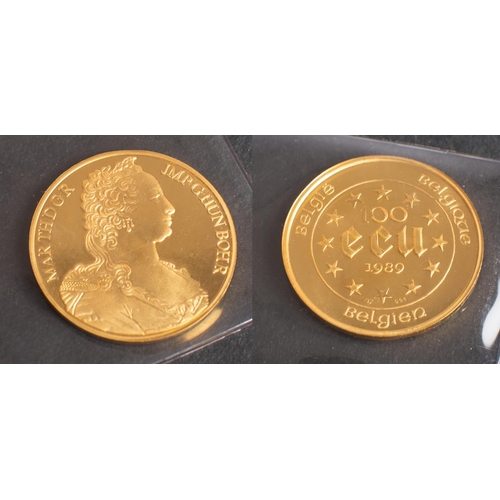 497 - A 'Maria Theresia' 100 ECU Belgian gold coin, dated 1989, diameter ca. 3.7cm, weight (inc plastic ca... 