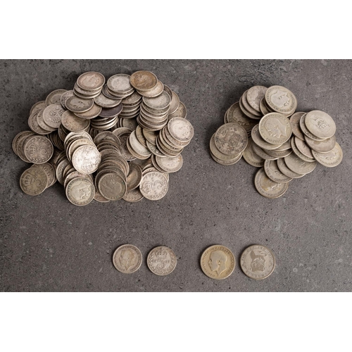 523 - A quantity of silver George V sixpences and threepences.