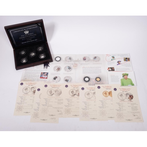 563 - Silver fifty pence set, boxed, Isle of Man, 2018, together with 70 years Our Queen set containing on... 