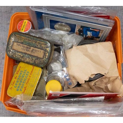 581 - A plastic tub containing boxes and tins of British, Commonwealth and World coin sets, Crowns, notes,... 