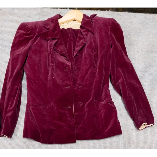 619 - Simpson of Piccadilly. A burgundy velvet lady's two piece jacket and skirt, the jacket, with double ... 