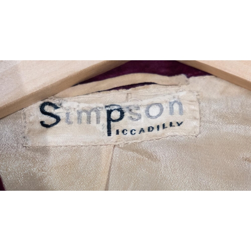 619 - Simpson of Piccadilly. A burgundy velvet lady's two piece jacket and skirt, the jacket, with double ... 