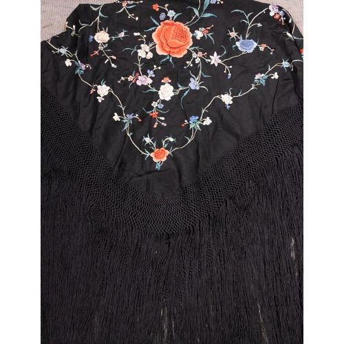 620 - A Victorian black silk shawl, with floral embroidered decoration and tassel fringe, 110cm x 100cm ex... 