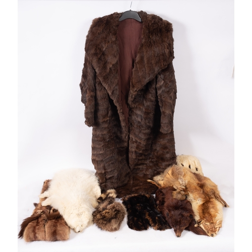 623 - A collection of various furs, comprising a full length fur coat, a fur jacket several fur stoles and... 