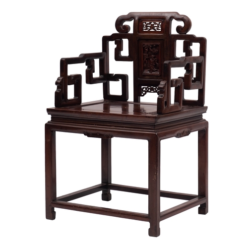 1052 - A Chinese huanghuali elbow chair, 19th century; the openwork backrest with a central splat with reli... 