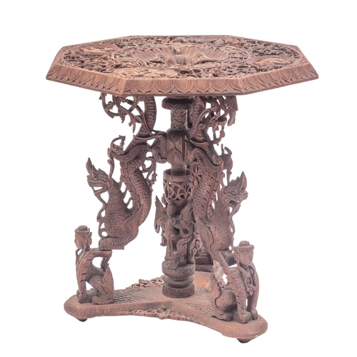 1053 - A South East Asian, probably Burmese carved and stained hardwood occasional table, circa 1900; the p... 