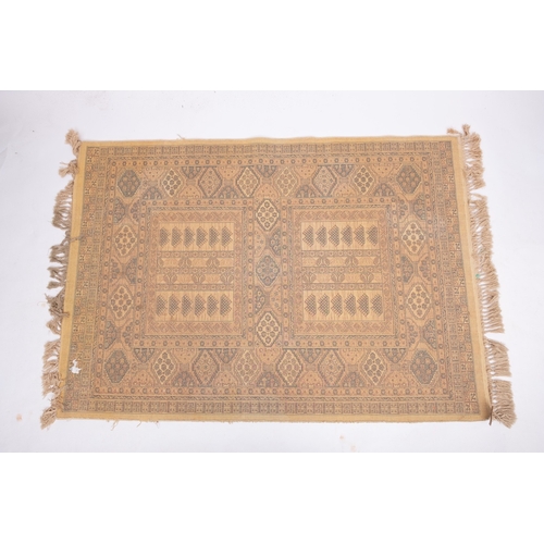 1064 - A Kurdish rug, the brick red field with ivory and pastel geometric medallions, enclosed by a main iv... 