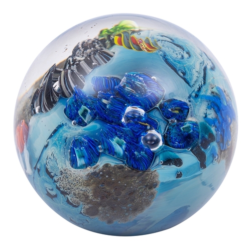 21 - Four signed glass paperweights, including a domed example by Michael Hook with central blue sphere a... 