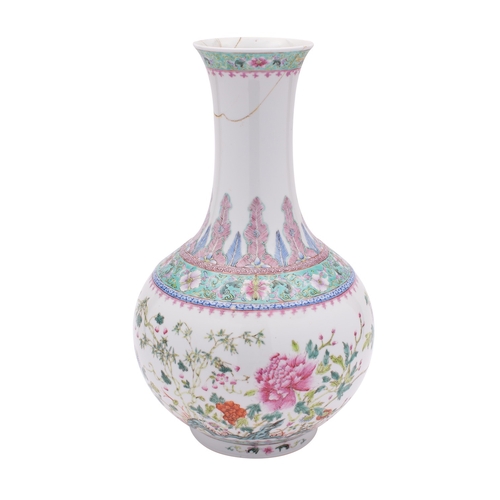 35 - A Chinese famille rose bottle vase painted with peony, bamboo and rockwork within floral turquoise g... 