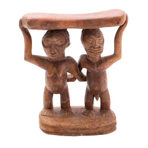 367 - A carved wood headrest, Luba (Baluba) tribe, Zaire, 20th century; the waisted tablet top held on the... 