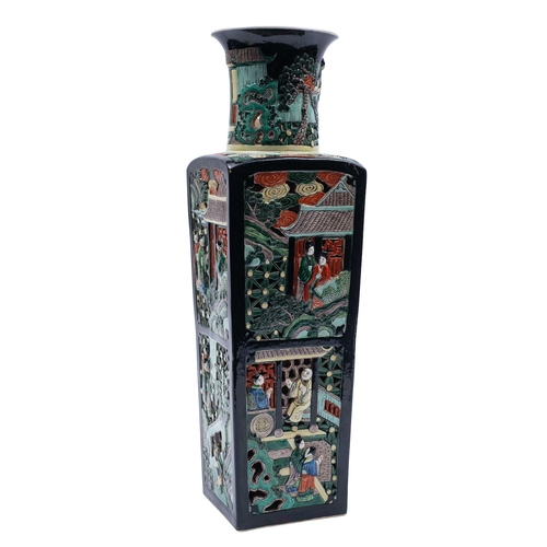 65 - A Chinese famille noire reticulated vase, of shouldered rectangular form each facet with pierced dec... 