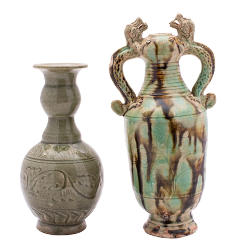 75 - A Chinese provincial dragon-handled vase and a celadon glazed bottle the first incised with two flow... 