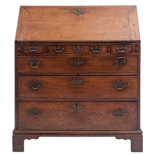 798 - A George II oak bureau, mid 18th century; the sloping hinged and cleated fall front enclosing a fitt... 