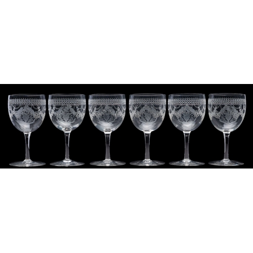 8 - Of India Interest. A set of six late Victorian/ Edwardian sherry glasses each etched with garlands a... 