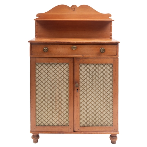 917 - A Regency pine chiffonier, circa 1815; the back gallery with serpentine top and shelf on twin turned... 