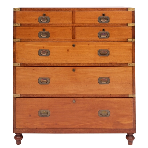 918 - An Irish Victorian teak and brass bound campaign chest of drawers, second half 19th century; in two ... 