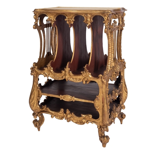 920 - A Victorian carved and giltwood Canterbury in Rococo Revival taste, mid 19th century; with scrolling... 