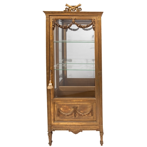 927 - A late 19th-century Continental giltwood vitrine; surmounted by ribbon tied quiver of arrows and fla... 