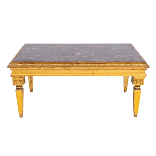 929 - A carved giltwood and marble topped rectangular low table in Louis XVI style, early 20th century; wi... 