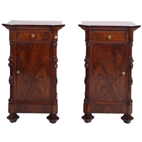 936 - A pair of Italian walnut bedside cabinets, last quarter 19th century; the tops with moulded edges, e... 