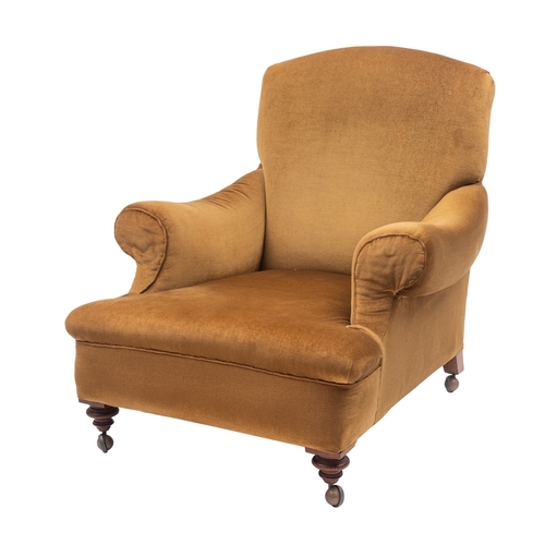 988 - A Victorian upholstered armchair, possibly by Howard & Sons; the bow shaped back over padded arms an... 