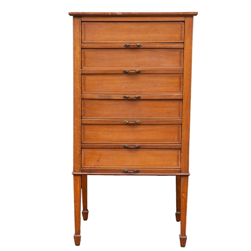 991 - An Edwardian satin maple filing chest, early 20th century; with banded top, the conforming drawer fr... 