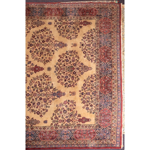 1080 - A Mahal carpet, the beige field with a geometric design of radiating palmettes and scrolling floral ... 