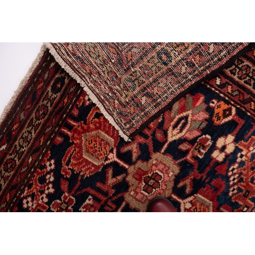 1073 - A Melayer runner, the shaded field with an over geometric design, enclosed by a main pistachio conti... 