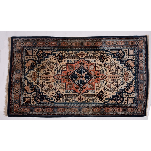 1076 - A Turkish carpet, the ivory stepped and pointed hexagonal field with rose and pastel blue flowerhead... 