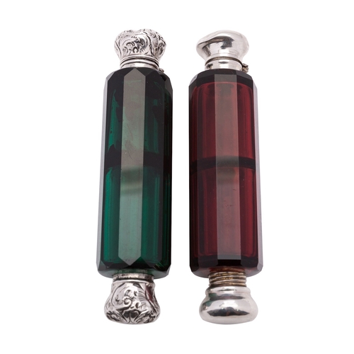 102 - Two Victorian silver mounted facetted coloured glass double ended scent bottles, both unmarked, the ... 