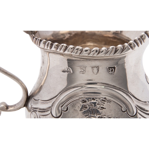 150 - A George III silver cream jug, maker's mark worn (..B?), London 1770, ogee baluster with a leaf-capp... 