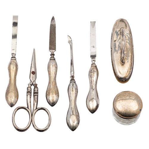 17 - A silver mounted manicure set by William Davenport, Birmingham 1924, in a fitted faux leather case, ... 