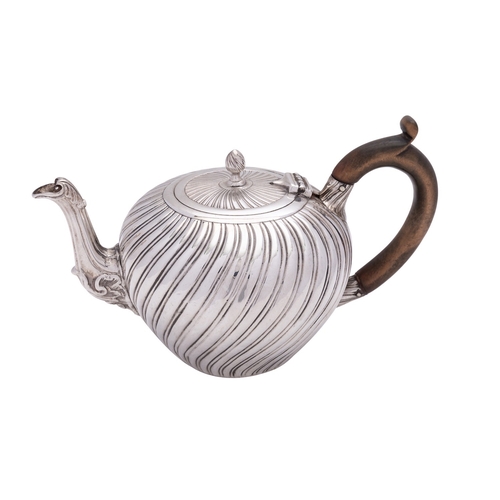 275 - A Victorian silver tea pot by Charles Stuart Harris, London 1882, with a wrythen finial to the flat ... 