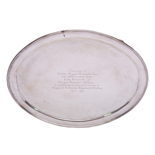 307 - A George V silver salver by William Comyns & Sons Ltd, London 1927, of oval form, with reeded rim ra... 