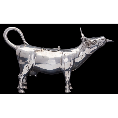 315 - A German silver cow creamer, stamped STERLING, GERMANY and 925, 1950s, with a bee atop the hinged co... 