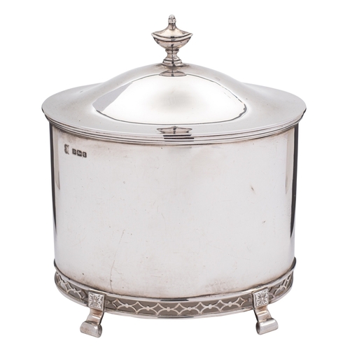 318 - A silver biscuit box by George Edward & Sons, Sheffield 1911, straight-sided oval with an urn finial... 