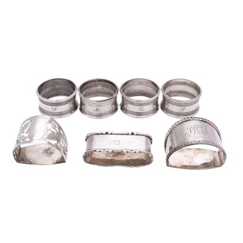 33 - A set of four silver circular napkin rings by Harman Brothers, Birmingham 1960, initialled; a D sect... 