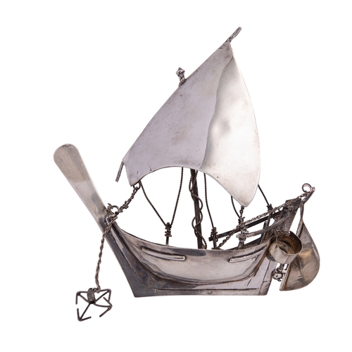 348 - A silver coloured model of a dhow, unmarked, 20th century, probably Gulf States, 12.5cm (5in) long, ... 