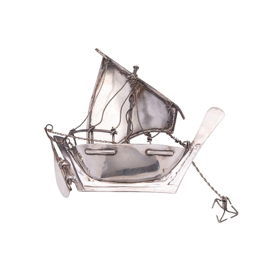 348 - A silver coloured model of a dhow, unmarked, 20th century, probably Gulf States, 12.5cm (5in) long, ... 