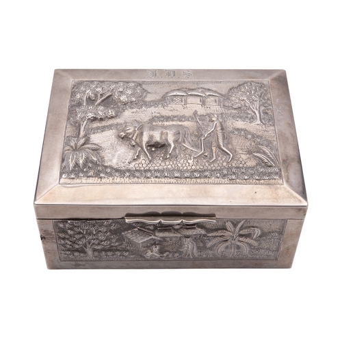 350 - An Indian silver table box, unmarked, Calcutta late 19th century, rectangular and chased with scenes... 