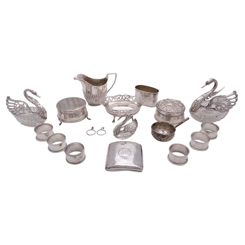 39 - A collection of silver, including: three graduated silver and glass swan dressing table boxes, an ov... 