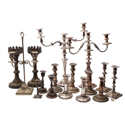 4 - A mixed collection of silver plated candlesticks, including: a pair by Elkington and Co, Birmingham,... 