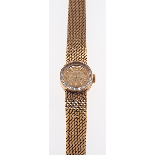 413 - Movado, a lady's gold wristwatch the round dial with raised baton numerals and patterned glass bezel... 