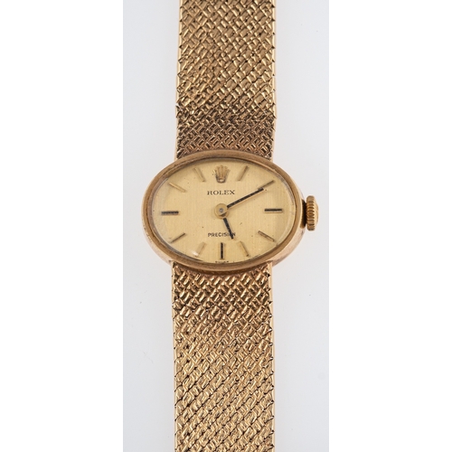 449 - Rolex a lady's 9ct gold wristwatch the oval dial with raised baton numerals, baton hands and signed ... 